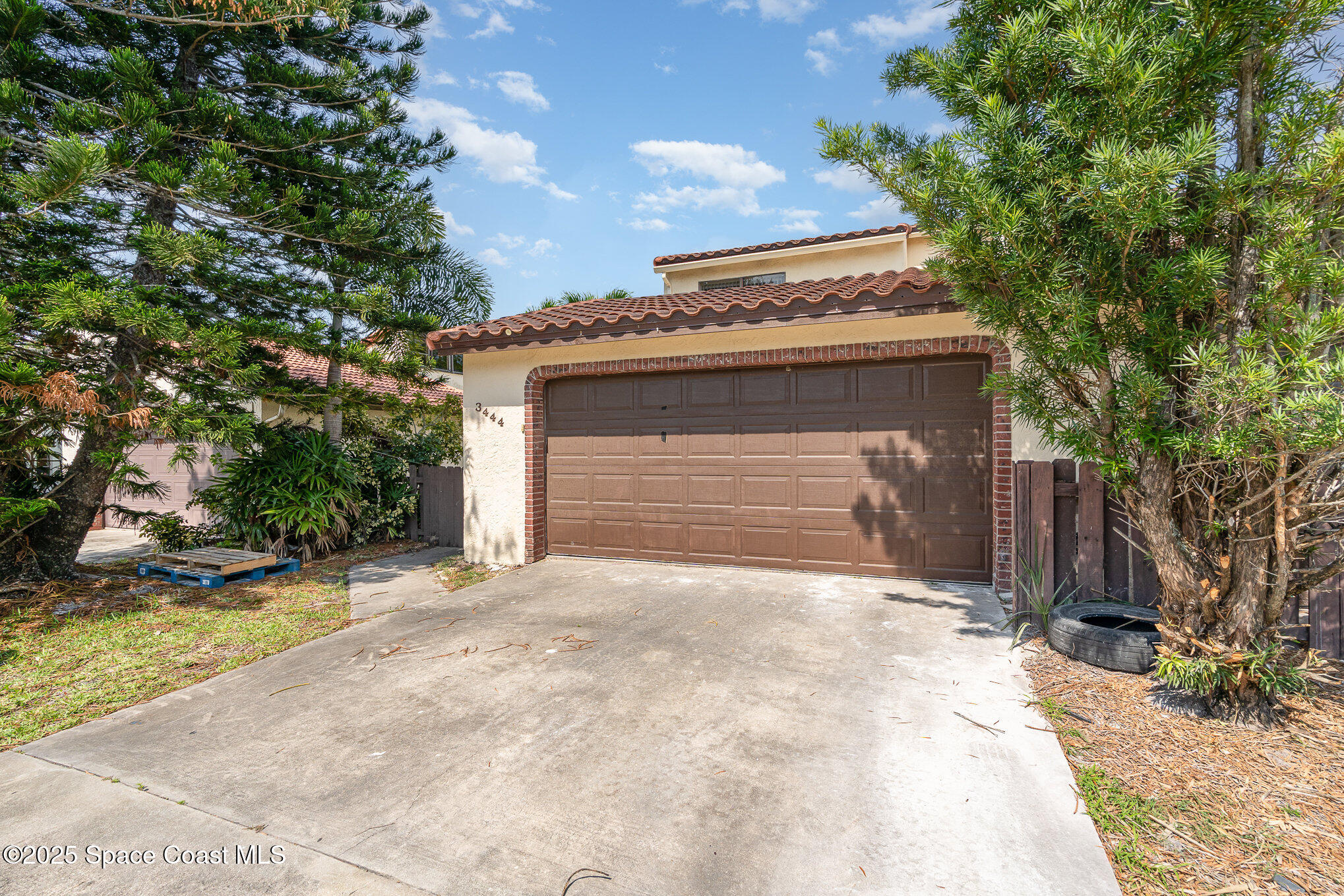 3444 Partridge Court Melbourne, FL 32935 - Photo 5 of 78 a front view of a house with a garage