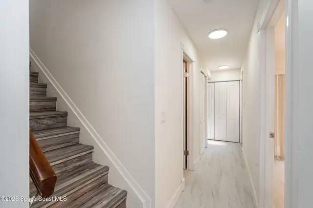 a kitchen with stainless steel appliances granite countertop a refrigerator stove microwave and sink