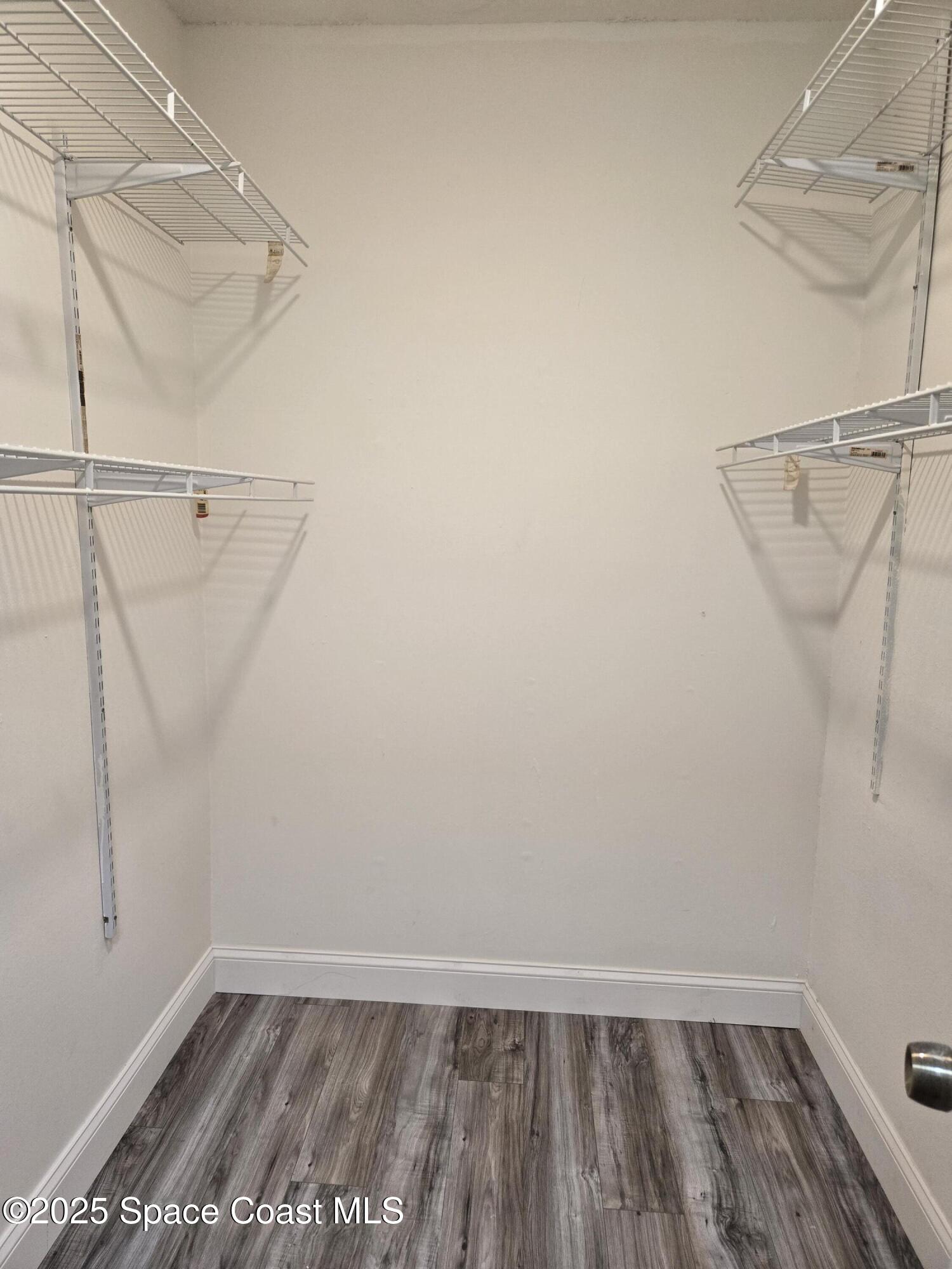 3444 Partridge Court Melbourne, FL 32935 - Photo 64 of 78 a view of walk in closet with empty racks