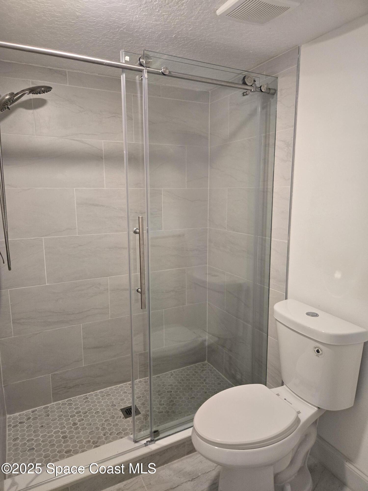 3444 Partridge Court Melbourne, FL 32935 - Photo 65 of 78 a white toilet next to a bathroom sink