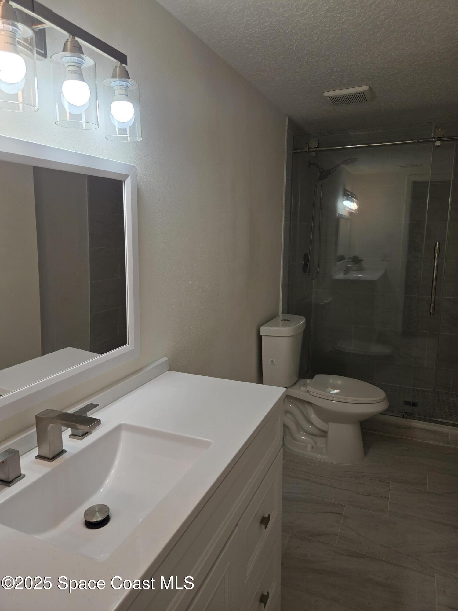 3444 Partridge Court Melbourne, FL 32935 - Photo 70 of 78 a bathroom with a sink toilet and shower