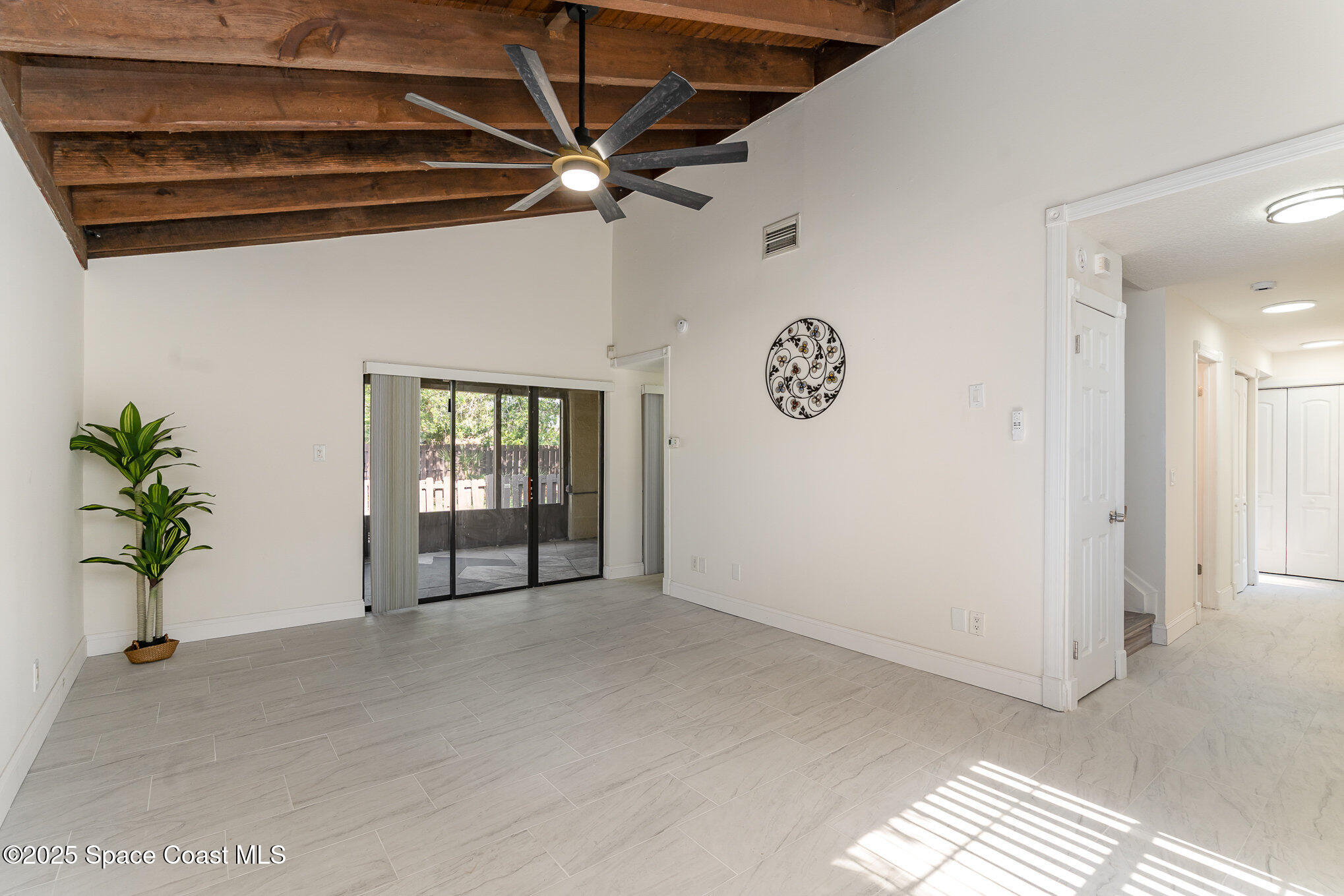 3444 Partridge Court Melbourne, FL 32935 - Photo 8 of 78 a view of an empty room with a window