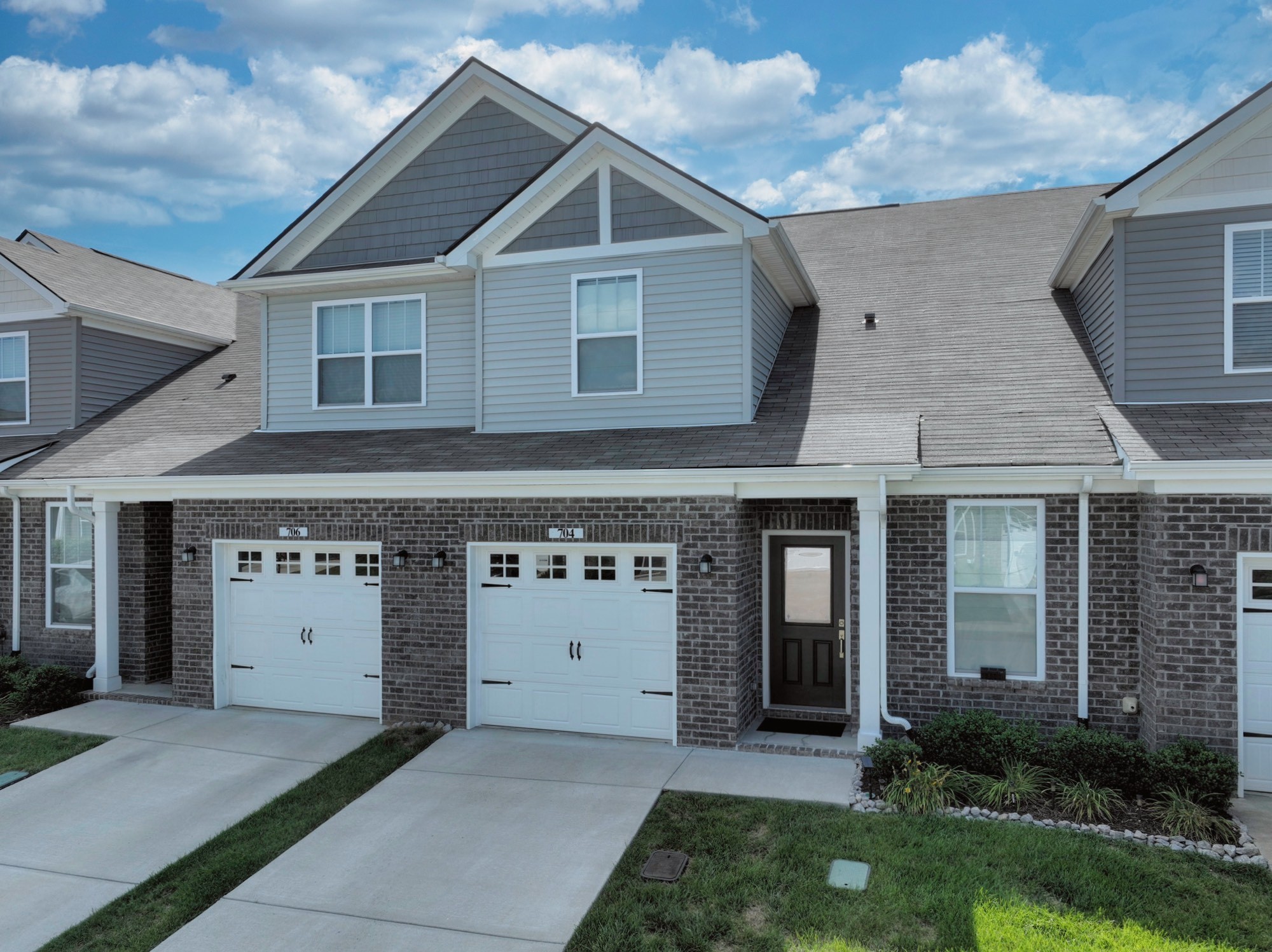 704 Mickelson Way Lebanon, TN 37087 - Photo 2 of 38 a front view of a house with a yard and garage