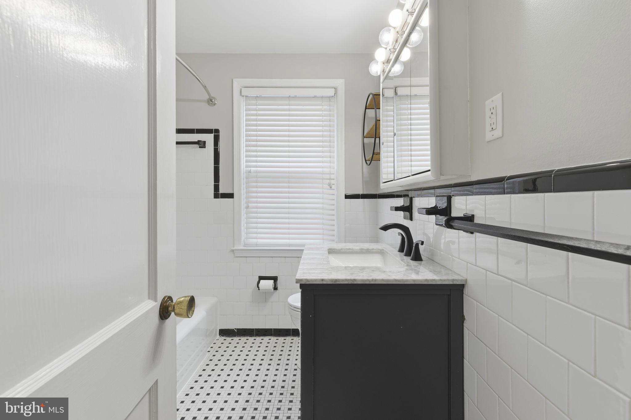 1587 Doxbury Road Towson, MD 21286 - Photo 17 of 31 Sleek modern bathroom with classic charm.