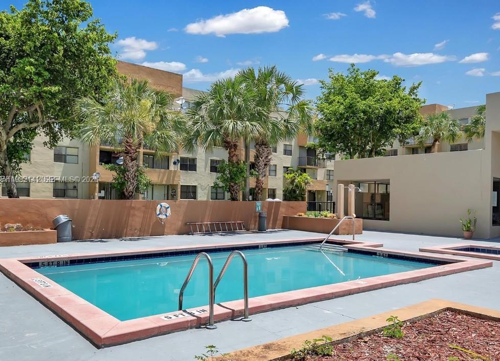8002 Southwest 149th Avenue, Unit B201 Miami, FL 33193 - Photo 12 of 13 a view of a chairs and table in the patio