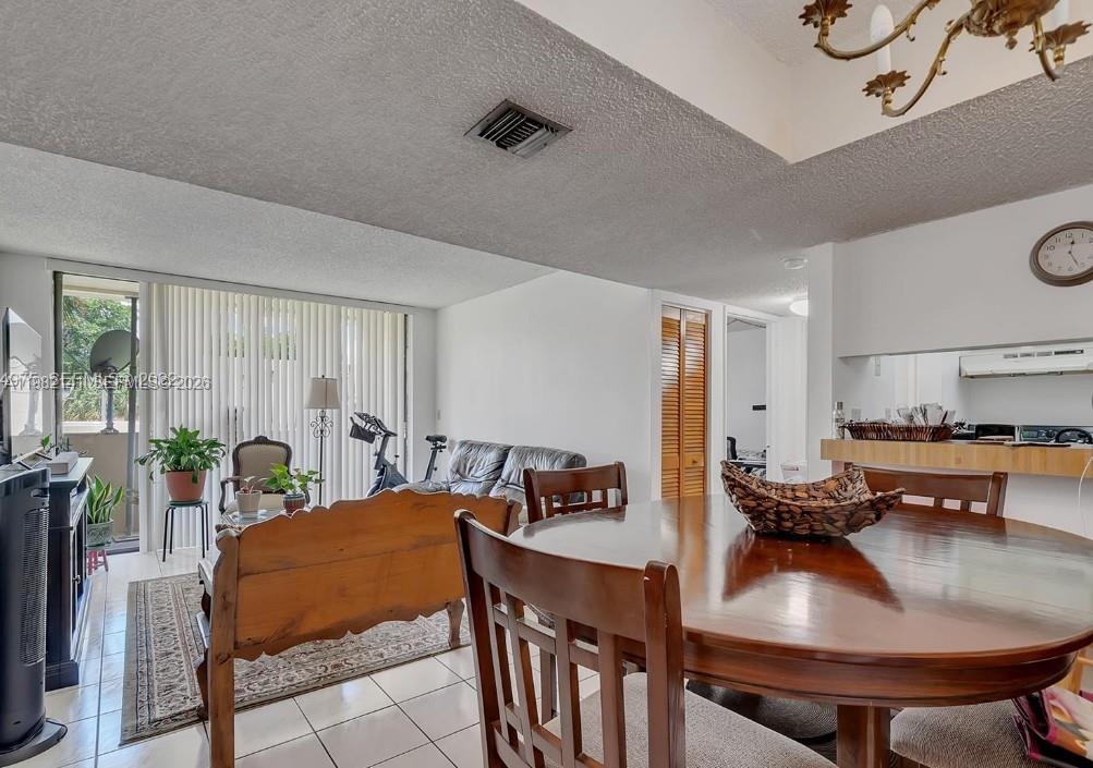 8002 Southwest 149th Avenue, Unit B201 Miami, FL 33193 - Photo 10 of 13 a view of a dining room with furniture