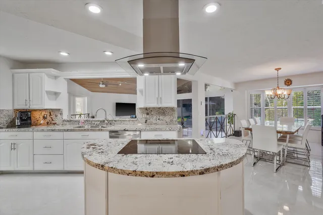 a kitchen with a table and chairs