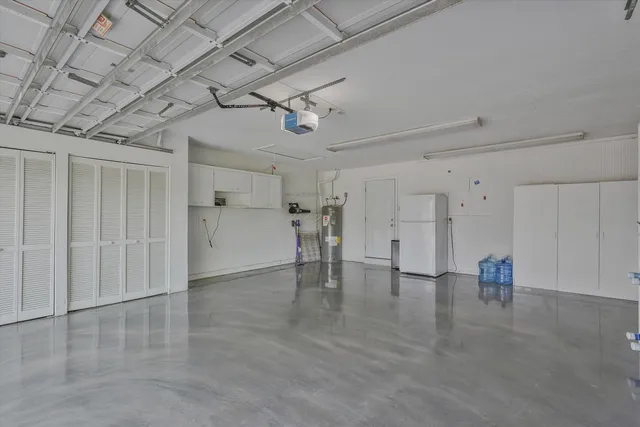 a view of a livingroom with a chair and a chandelier
