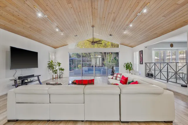 a living room with furniture and flowers