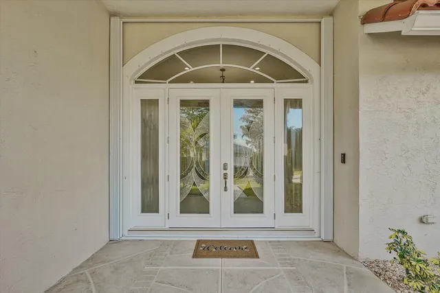 a view of a door and a window