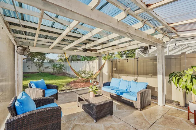 a building outdoor space with patio couches and pool