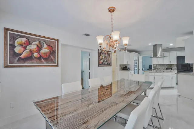 a view of a dining room and a livingroom