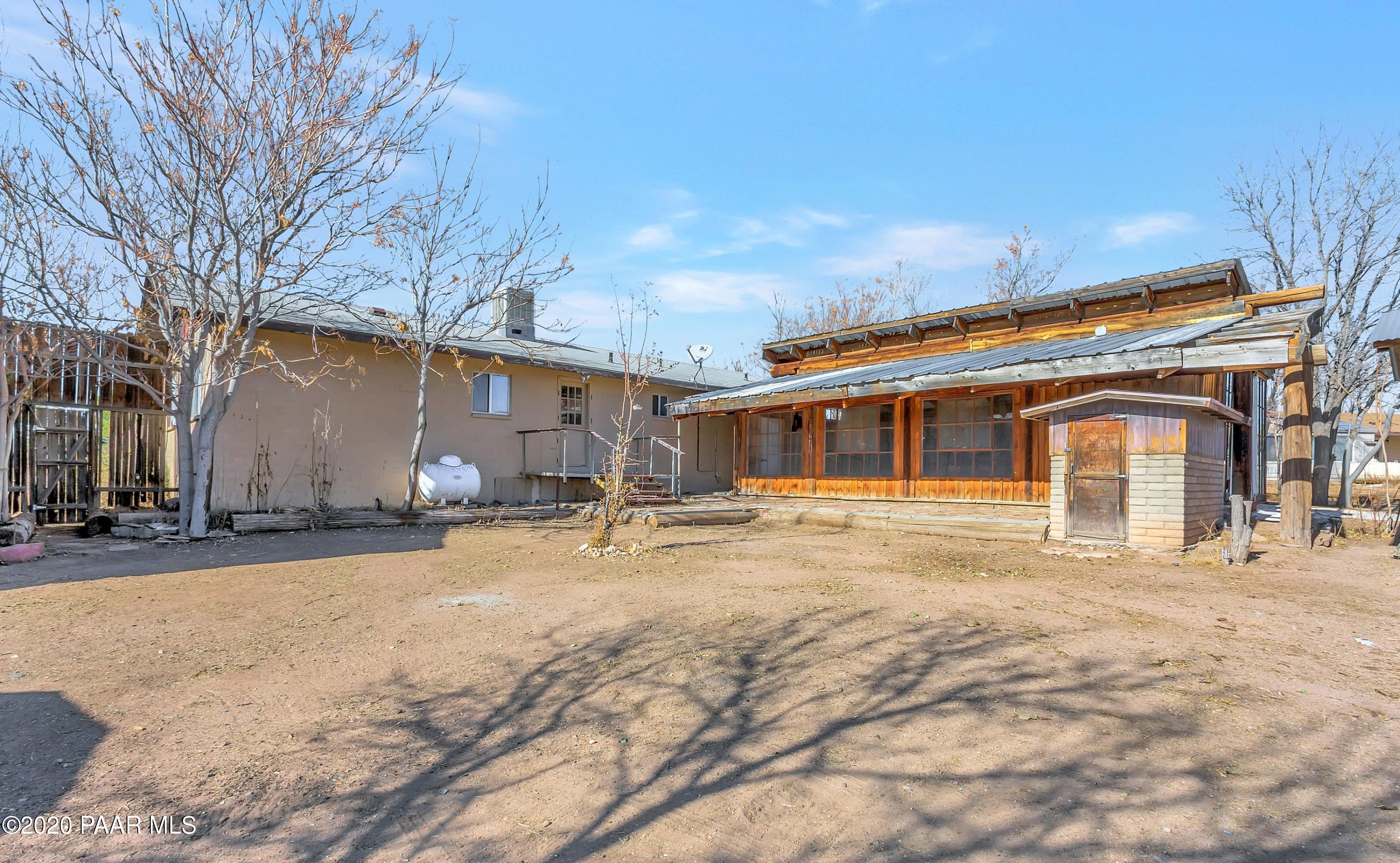 2571 North Reed Road Chino Valley, AZ 86323 - Photo 12 of 25 a front view of a house with a yard and garage