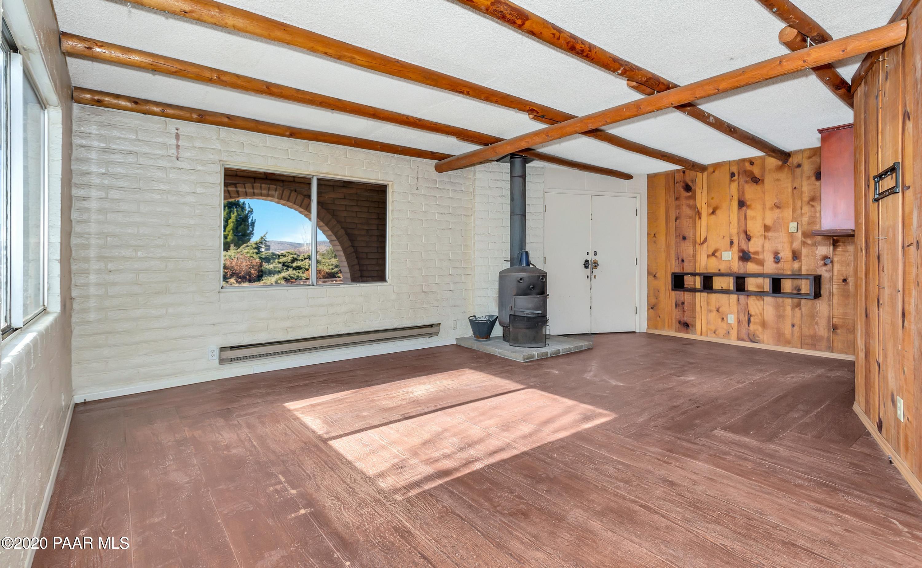 2571 North Reed Road Chino Valley, AZ 86323 - Photo 2 of 25 a view of a room with wooden floor and window
