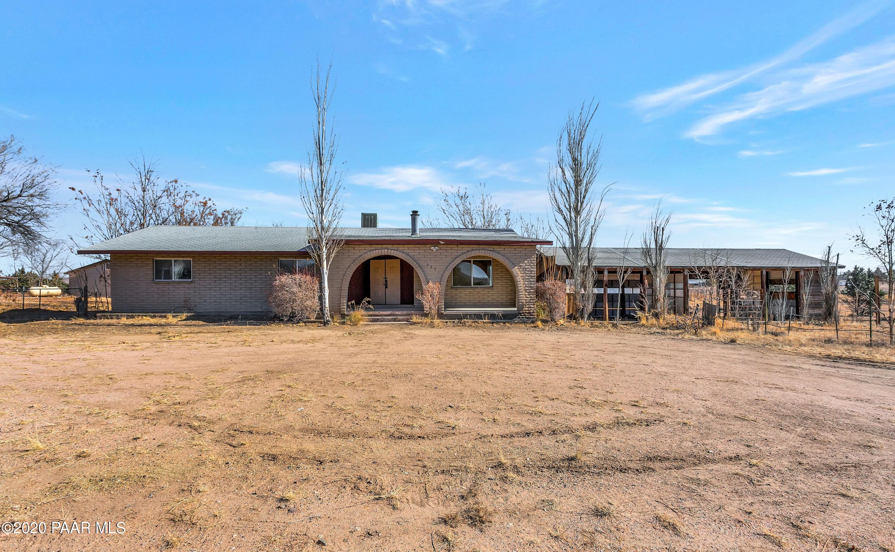 2571 North Reed Road Chino Valley, AZ 86323 - Photo 25 of 25 a front view of a house with a yard and garage