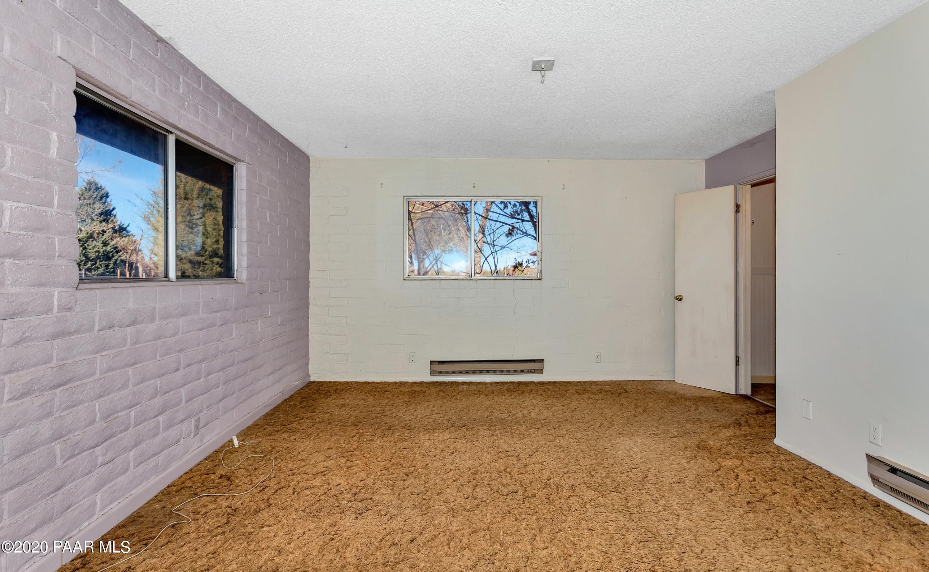 2571 North Reed Road Chino Valley, AZ 86323 - Photo 7 of 25 a view of an empty room with a window