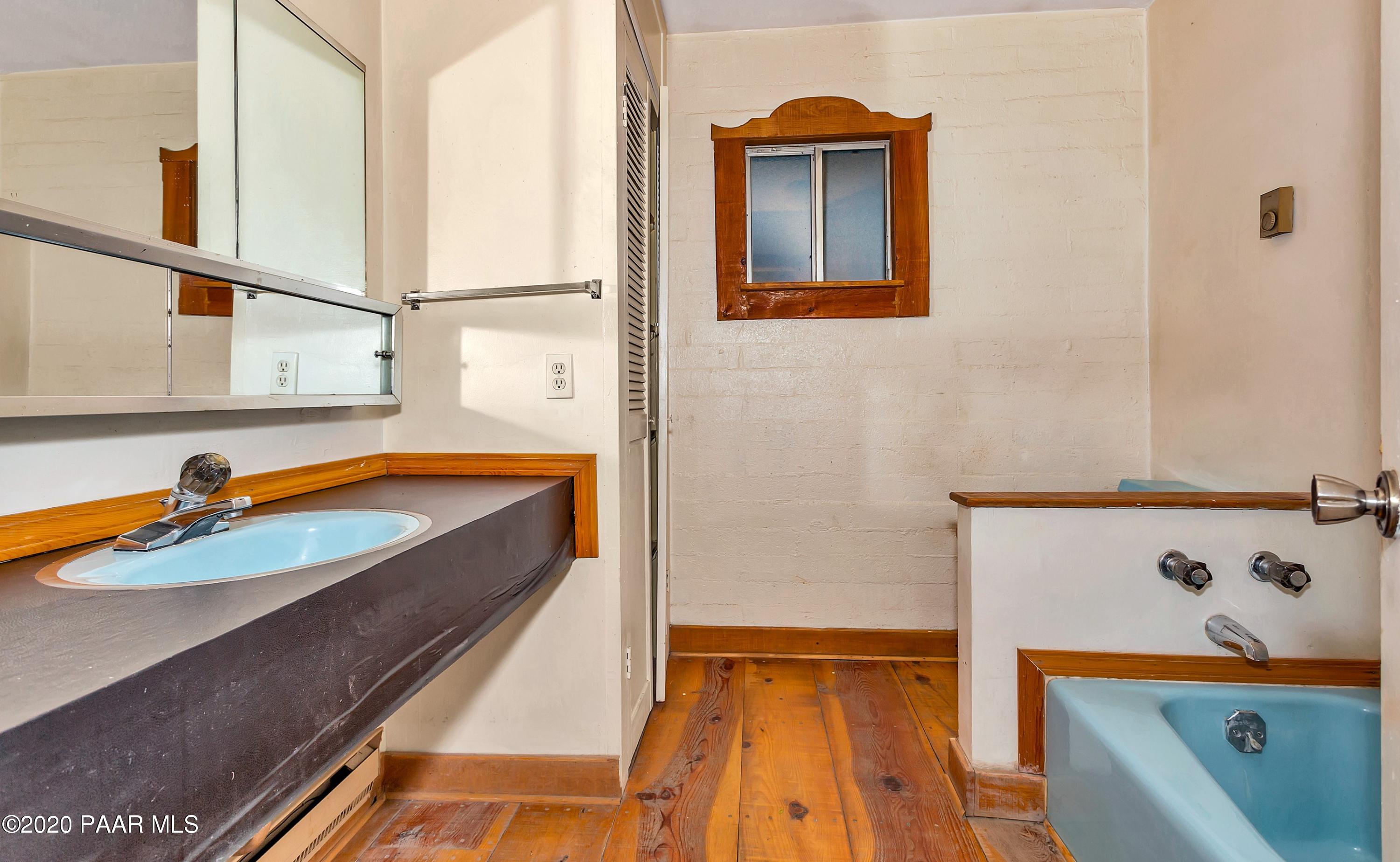 2571 North Reed Road Chino Valley, AZ 86323 - Photo 10 of 25 a bathroom with a tub sink and mirror