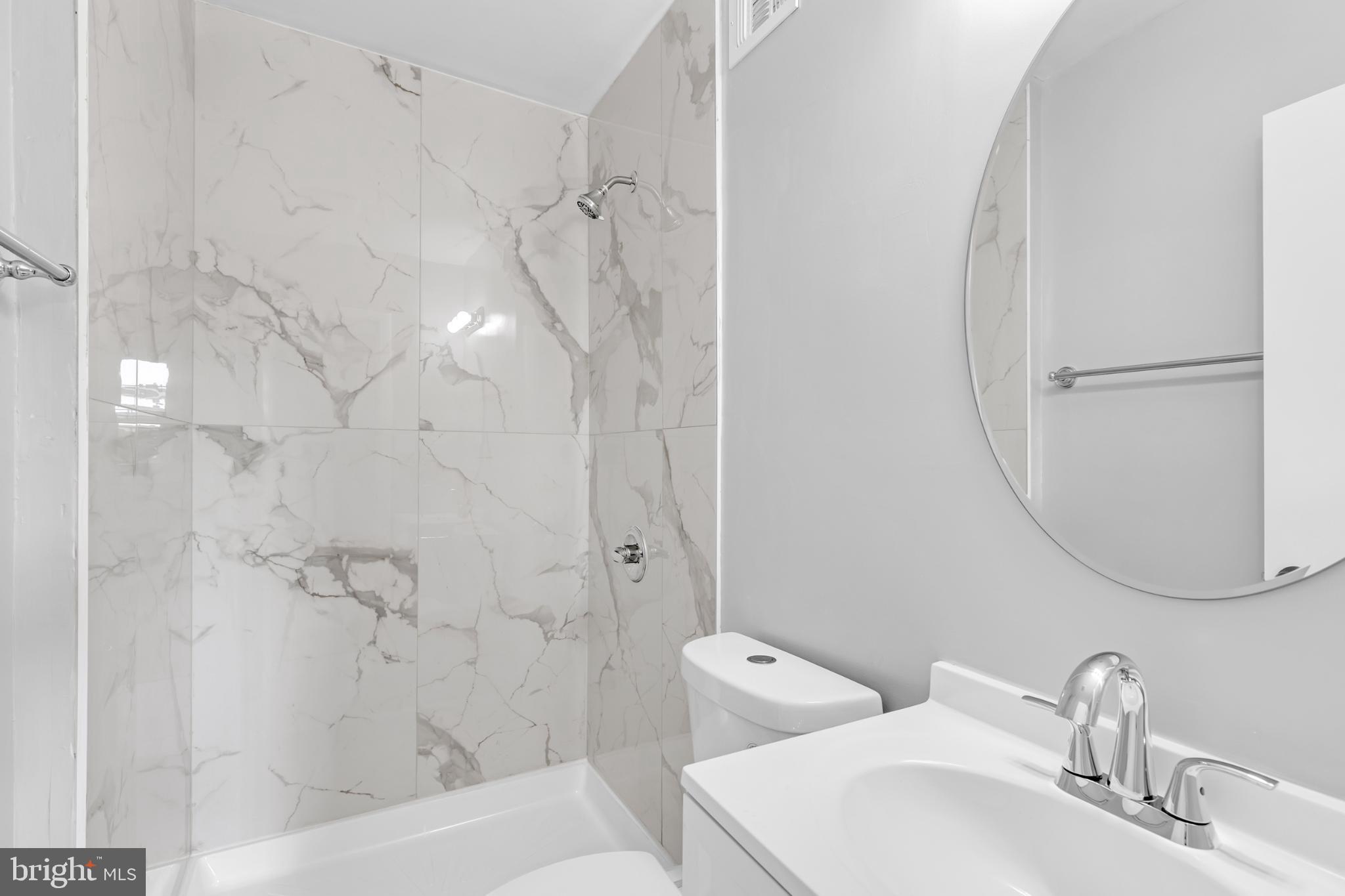 7403 Larne Lane Lorton, VA 22079 - Photo 15 of 31 a bathroom with a sink and shower