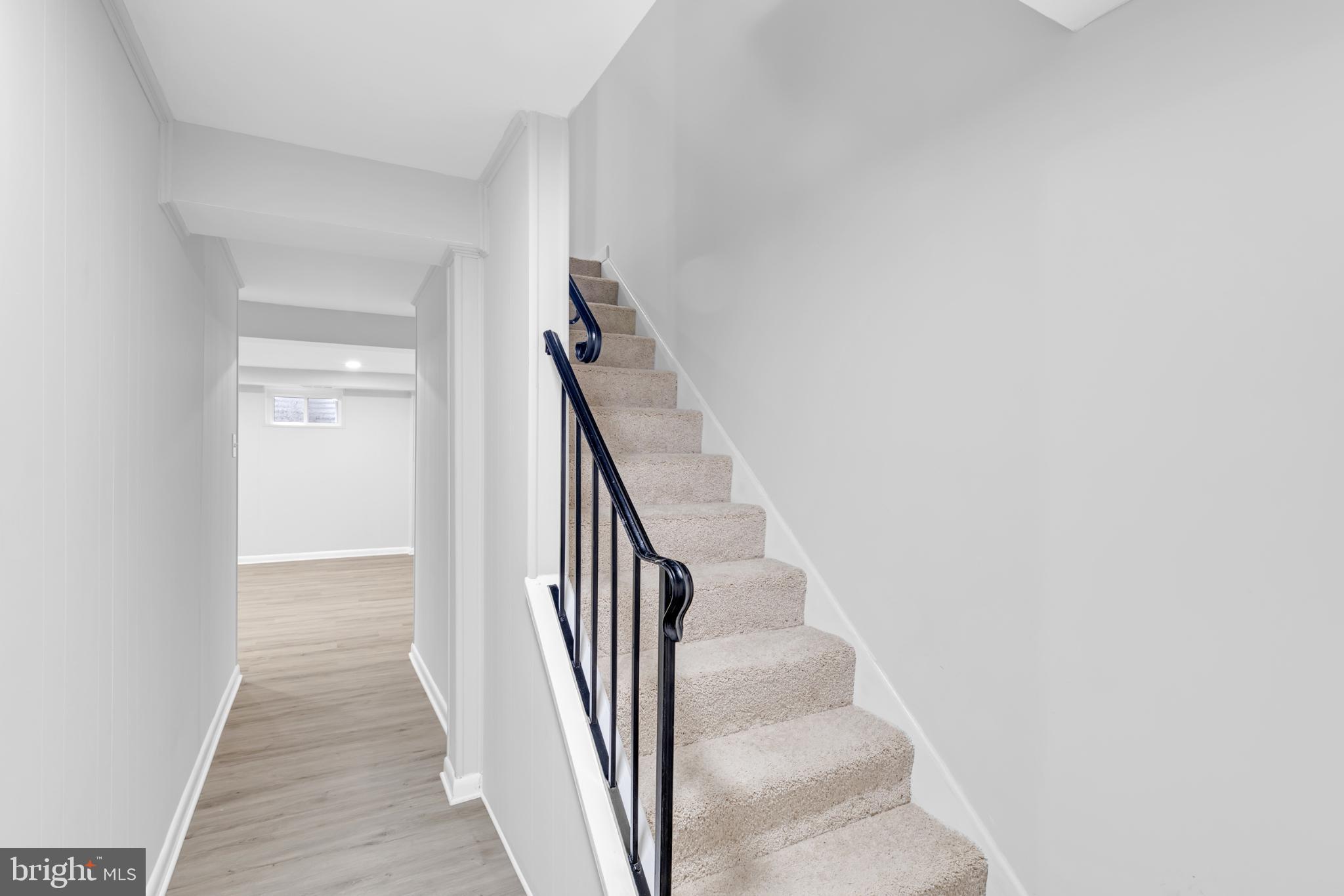 7403 Larne Lane Lorton, VA 22079 - Photo 21 of 31 a view of a hallway with wooden floor and entryway