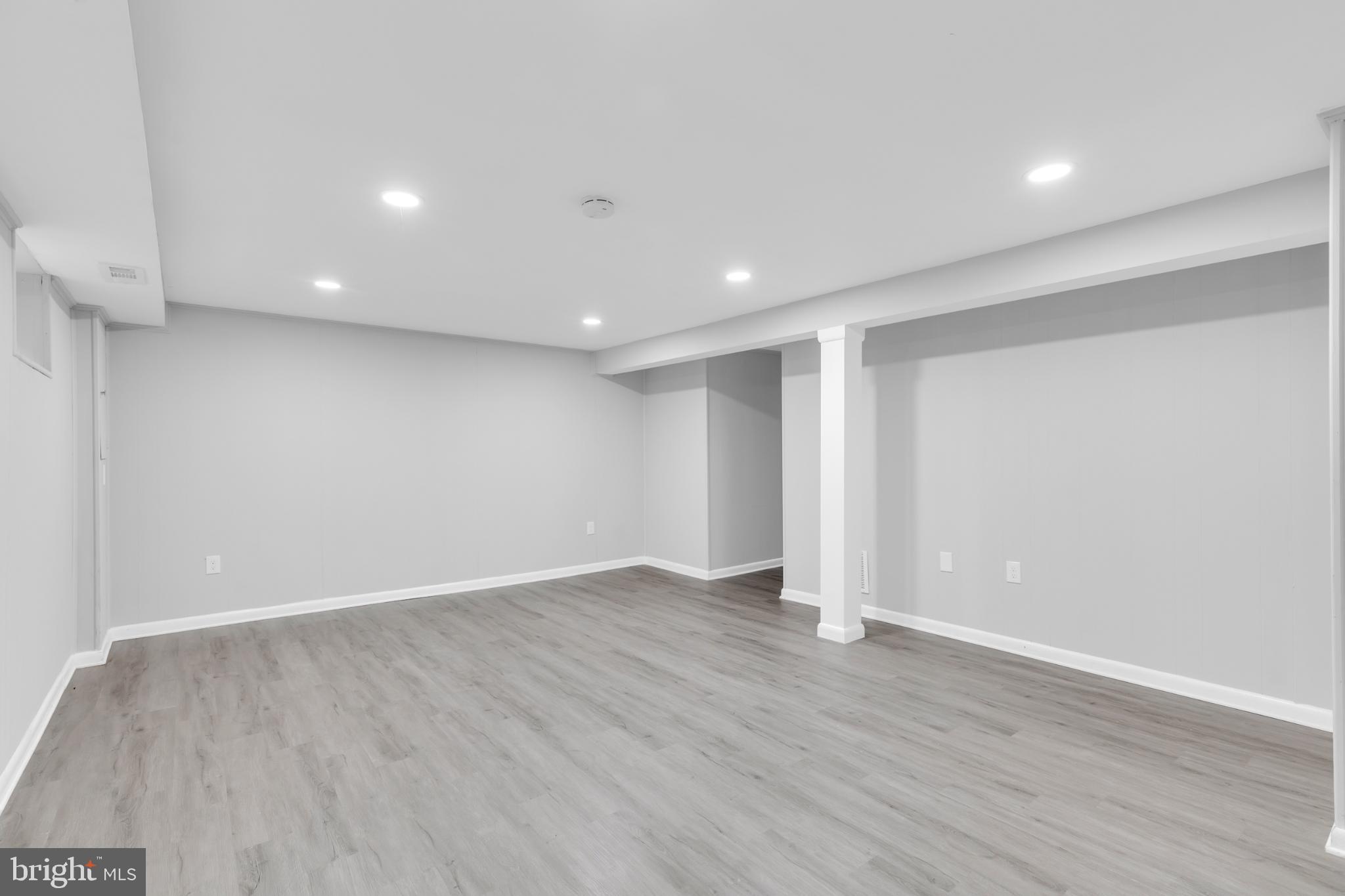 7403 Larne Lane Lorton, VA 22079 - Photo 22 of 31 a view of an empty room with wooden floor