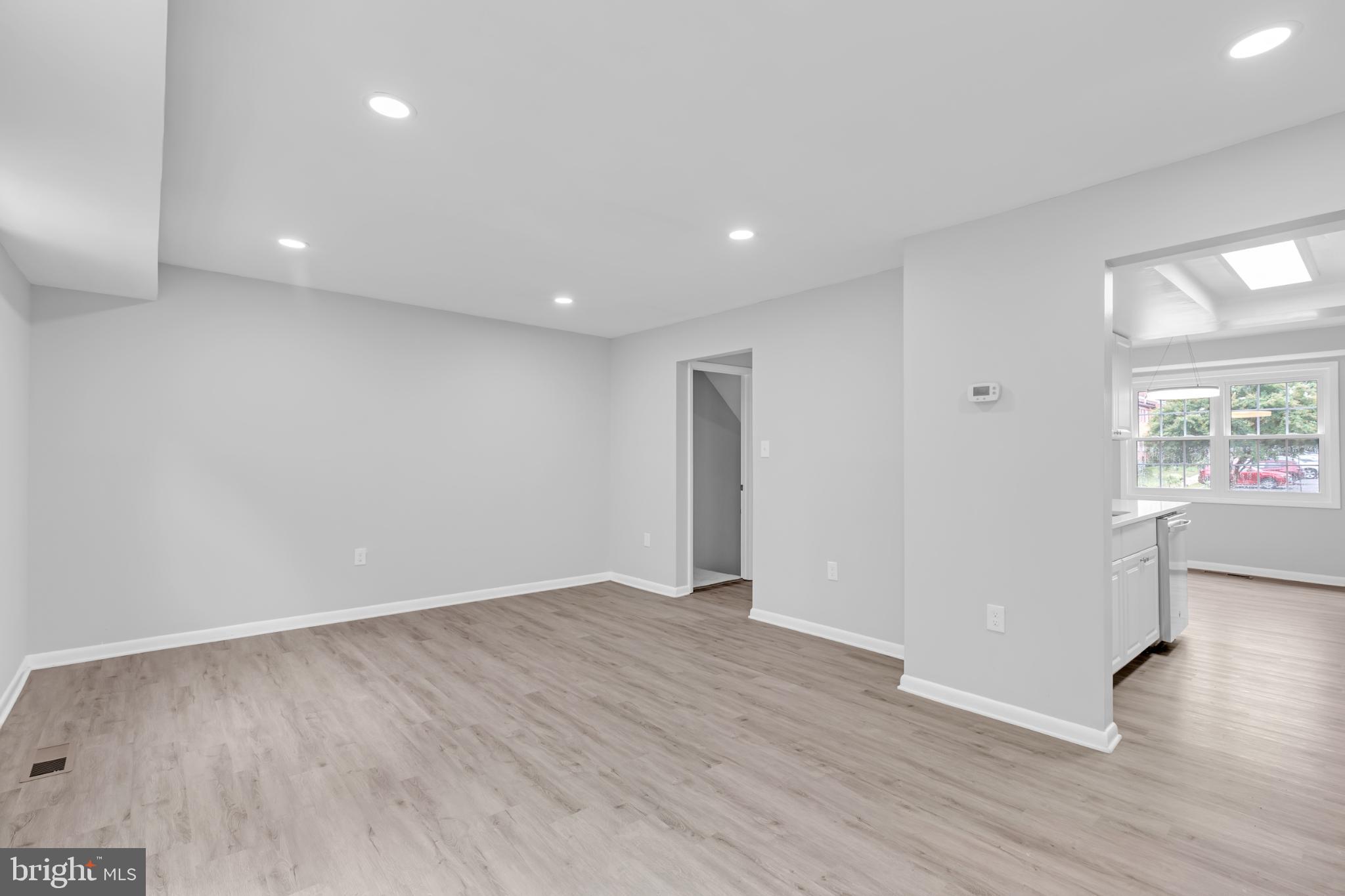 7403 Larne Lane Lorton, VA 22079 - Photo 10 of 31 a view of an empty room with wooden floor and a window