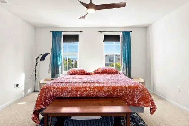 a bedroom with a bed and window