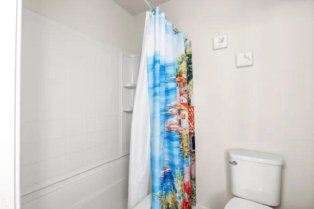 a kitchen with stainless steel appliances kitchen island granite countertop a refrigerator and a sink