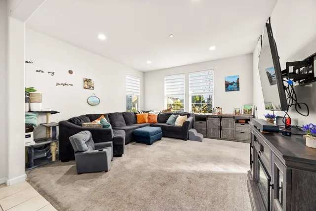a living room with furniture fireplace and a flat screen tv