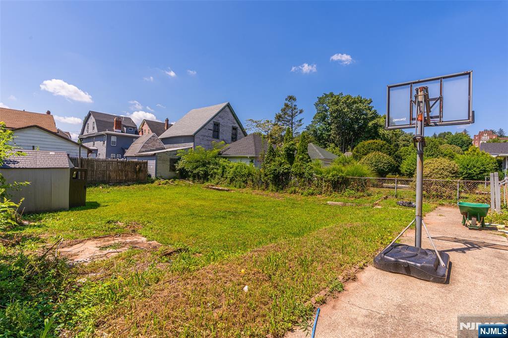 24 Swaine Place, Unit 22 West Orange, NJ 07052 - Photo 15 of 27 a front view of a house with garden
