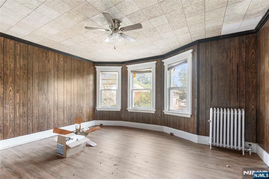 24 Swaine Place, Unit 22 West Orange, NJ 07052 - Photo 20 of 27 an empty room with wooden floor and windows