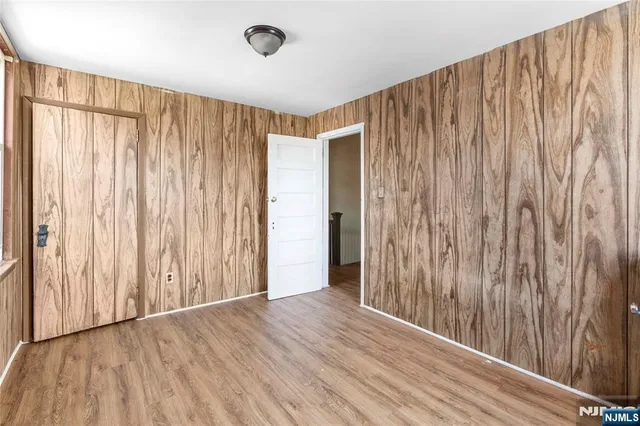a view of a room with wooden walls