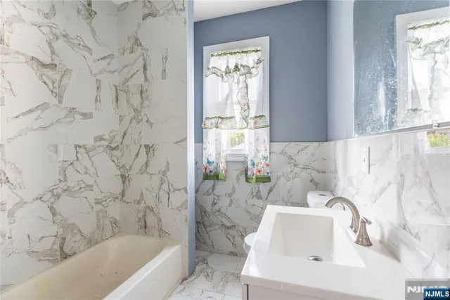 a bathroom with a sink and a bathtub