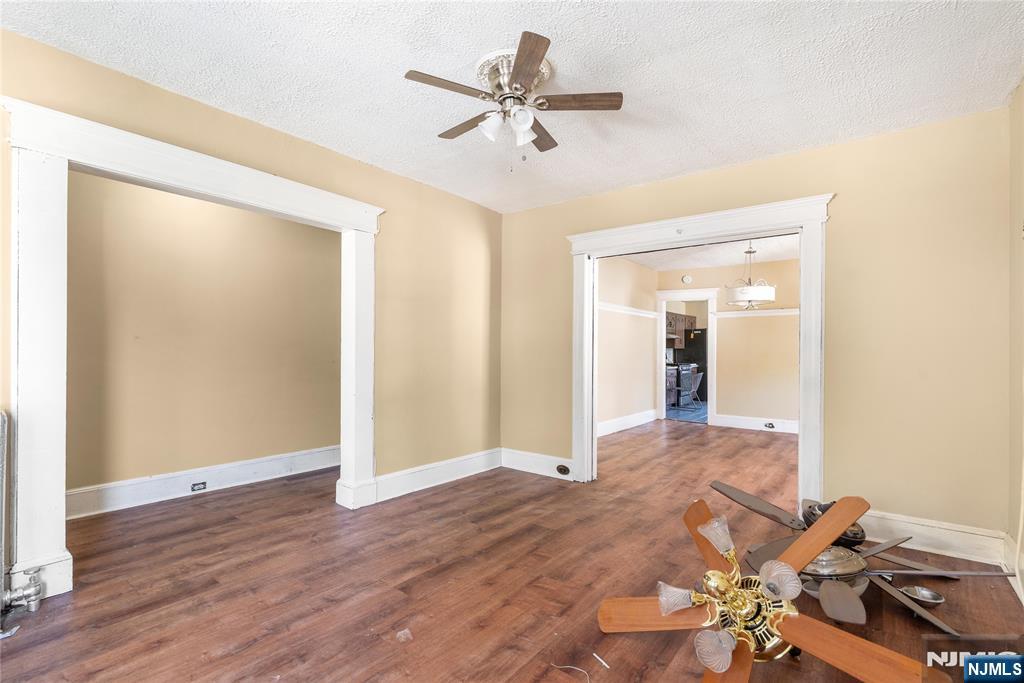 24 Swaine Place, Unit 22 West Orange, NJ 07052 - Photo 8 of 27 wooden floor in an empty room with a window