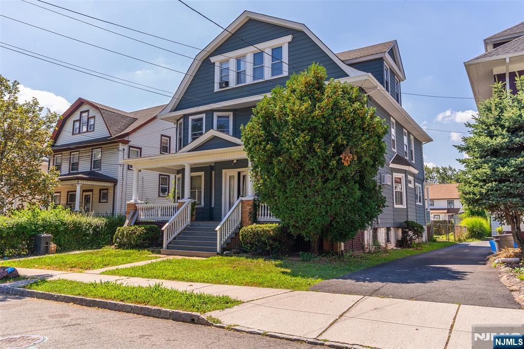 24 Swaine Place, Unit 22 West Orange, NJ 07052 - Photo 10 of 27 a front view of a house with garden