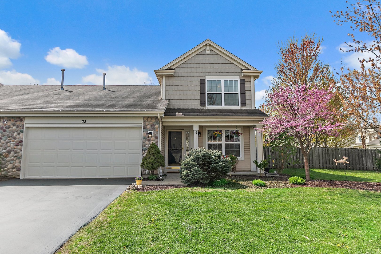23 Boathouse Road Pingree Grove, IL 60140 - Photo 2 of 25 a front view of a house with garden