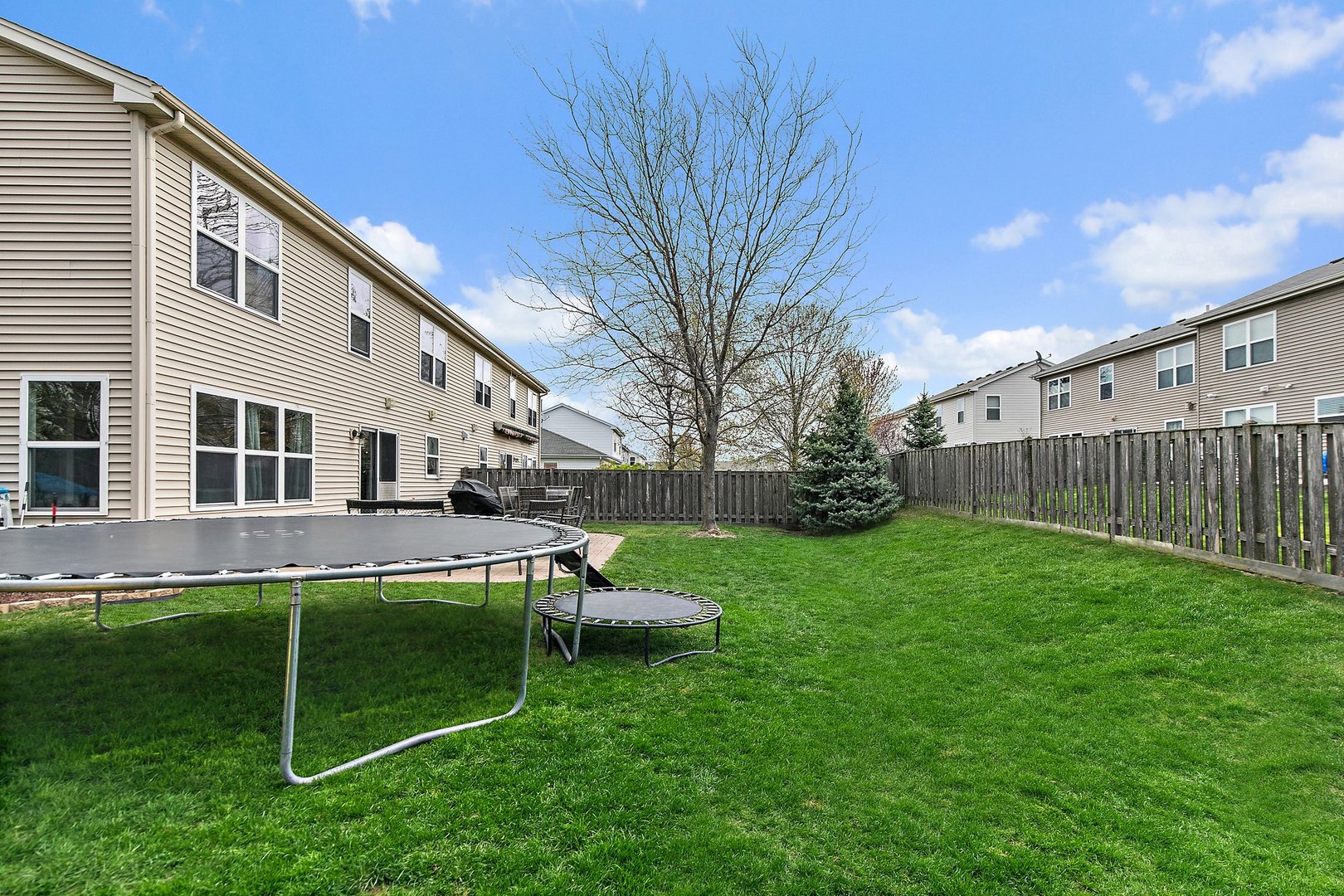 23 Boathouse Road Pingree Grove, IL 60140 - Photo 23 of 25 a view of a house with backyard and a slide
