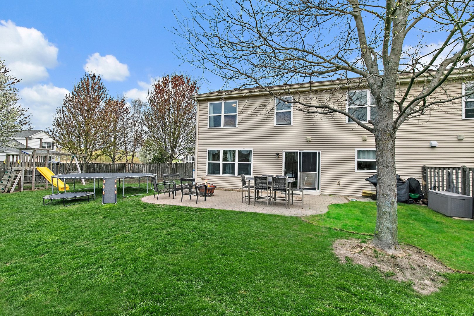 23 Boathouse Road Pingree Grove, IL 60140 - Photo 24 of 25 a front view of a house with backyard and sitting area