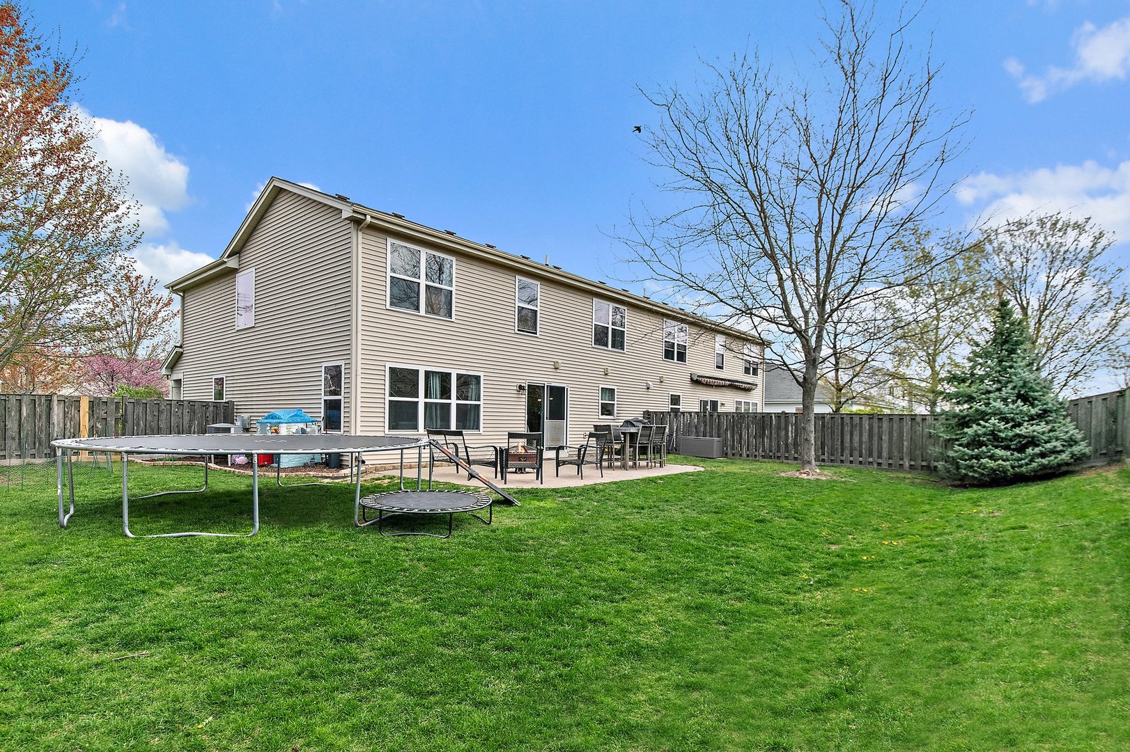 23 Boathouse Road Pingree Grove, IL 60140 - Photo 25 of 25 a view of a house with a yard and sitting area