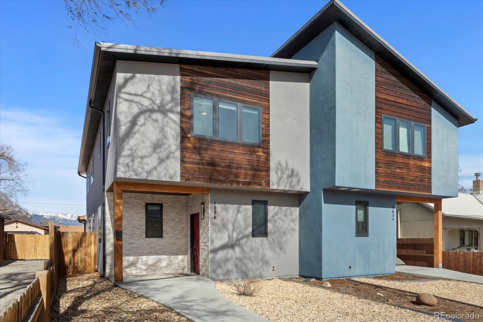 1036 H Street Salida, CO 81201 - Photo 1 of 50 a front view of a house with garden