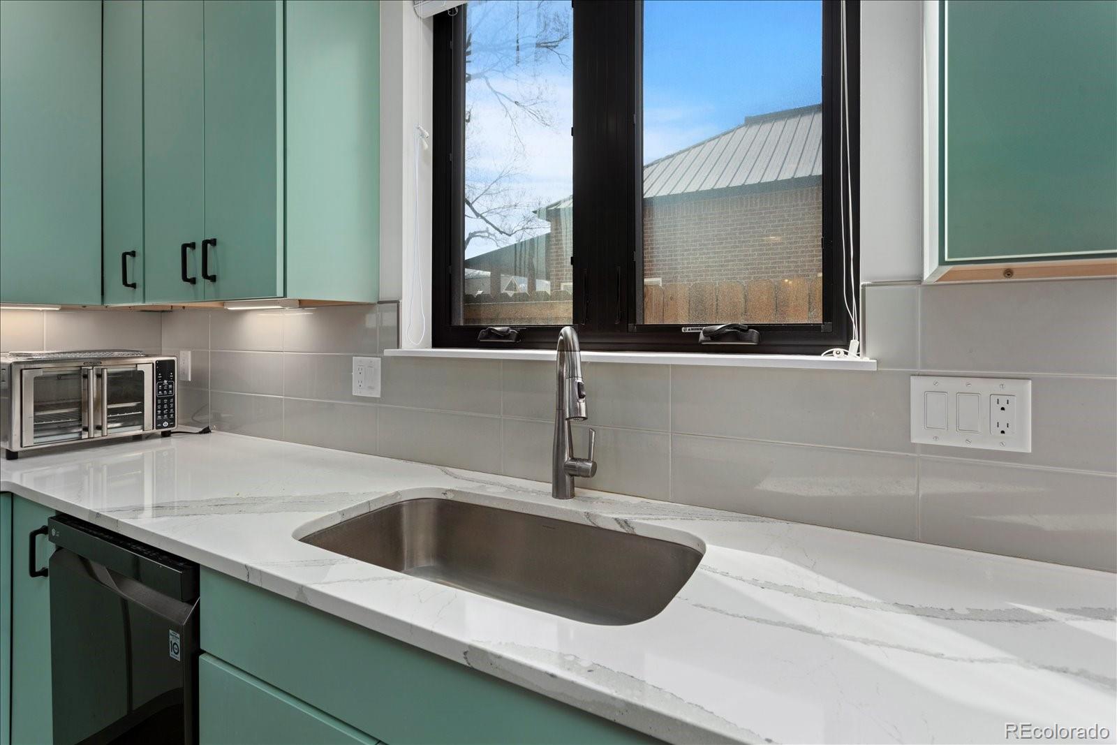 1036 H Street Salida, CO 81201 - Photo 23 of 50 a kitchen with a sink and a window