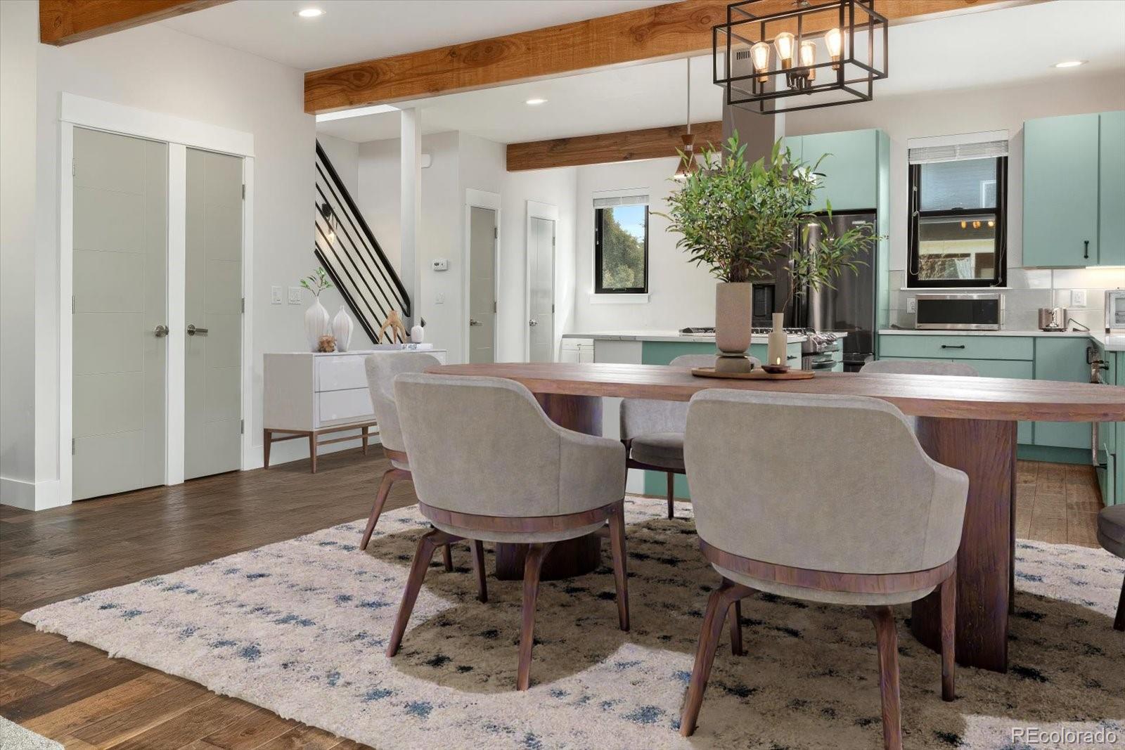 1036 H Street Salida, CO 81201 - Photo 25 of 50 a dining room with furniture a chandelier and wooden floor