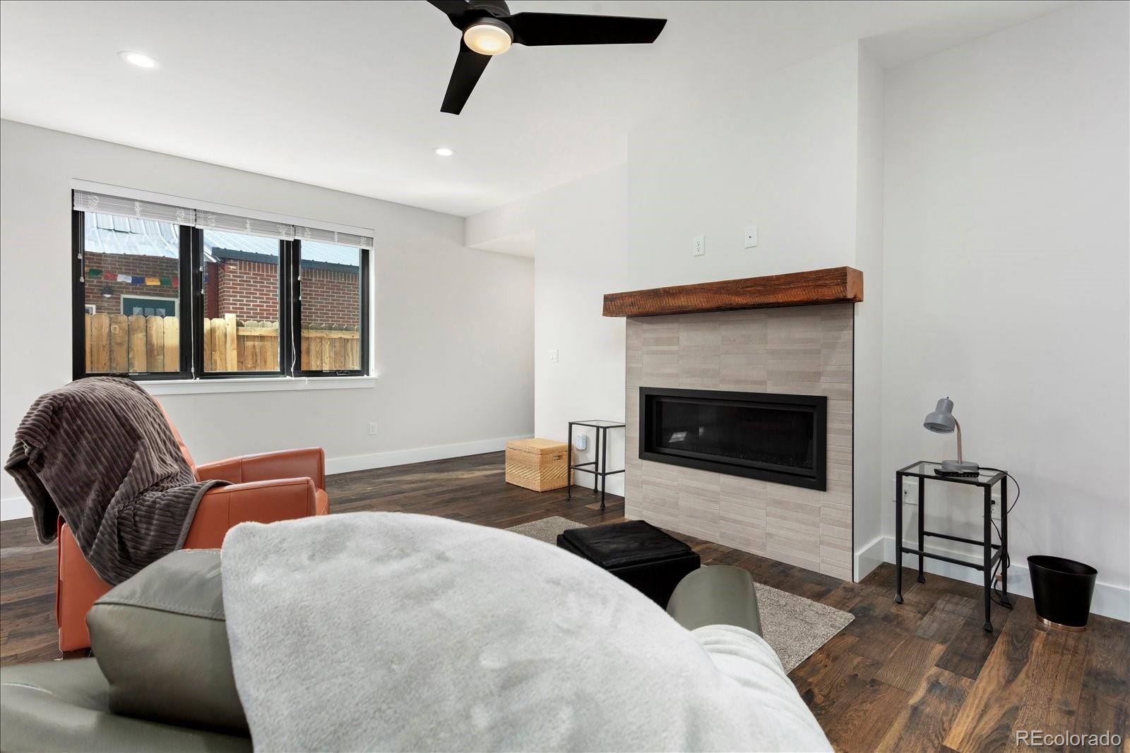 1036 H Street Salida, CO 81201 - Photo 29 of 50 a bedroom with furniture and a fireplace