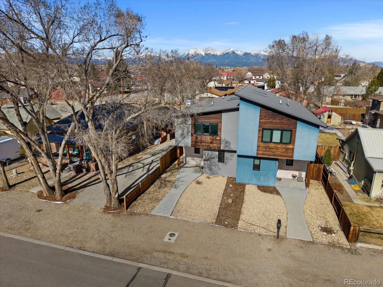 1036 H Street Salida, CO 81201 - Photo 3 of 50 a view of a terrace with chairs and a fire pit