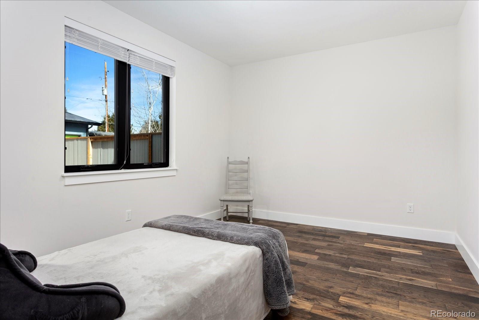 1036 H Street Salida, CO 81201 - Photo 31 of 50 a bedroom with a bed and a window