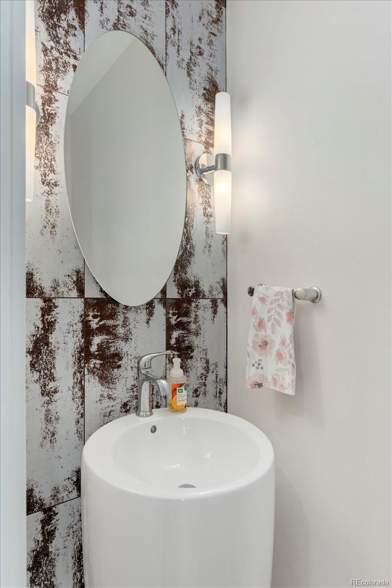 1036 H Street Salida, CO 81201 - Photo 36 of 50 a bathroom with a sink and mirror