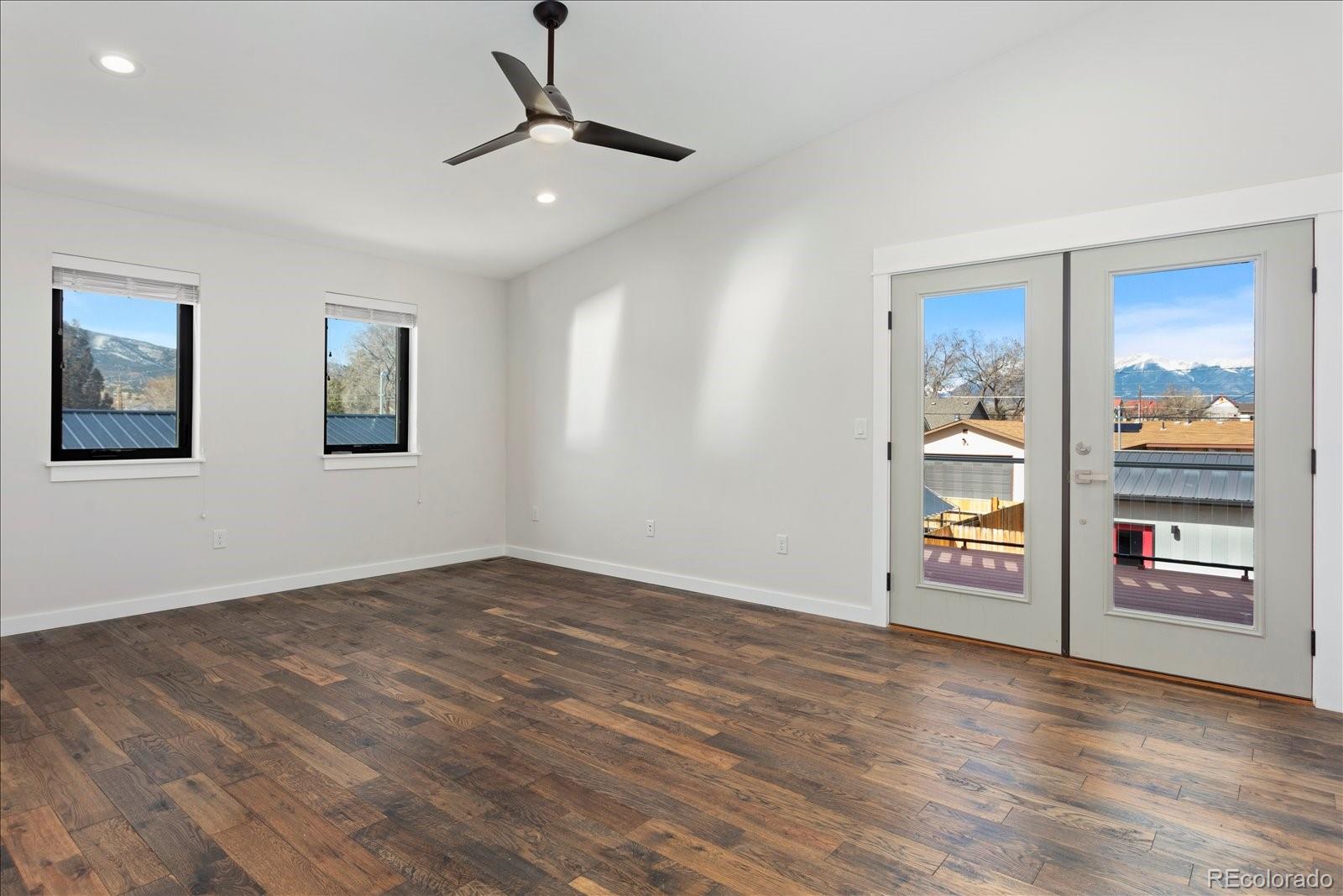 1036 H Street Salida, CO 81201 - Photo 39 of 50 wooden floor in an empty room with a window