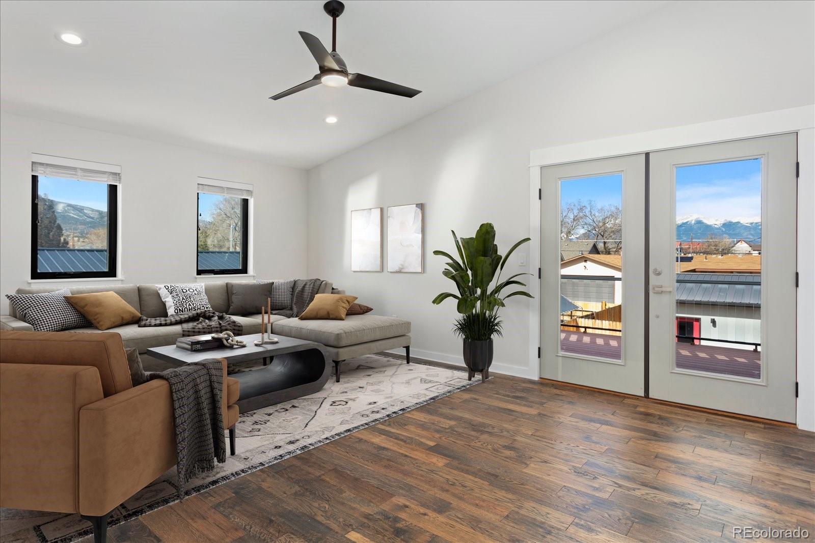 1036 H Street Salida, CO 81201 - Photo 40 of 50 a living room with furniture and a flat screen tv