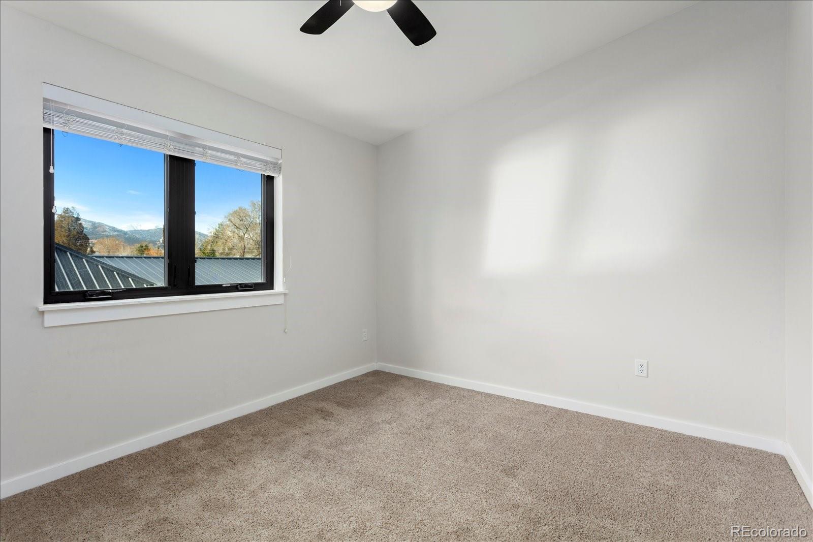 1036 H Street Salida, CO 81201 - Photo 42 of 50 an empty room with ceiling fan and window