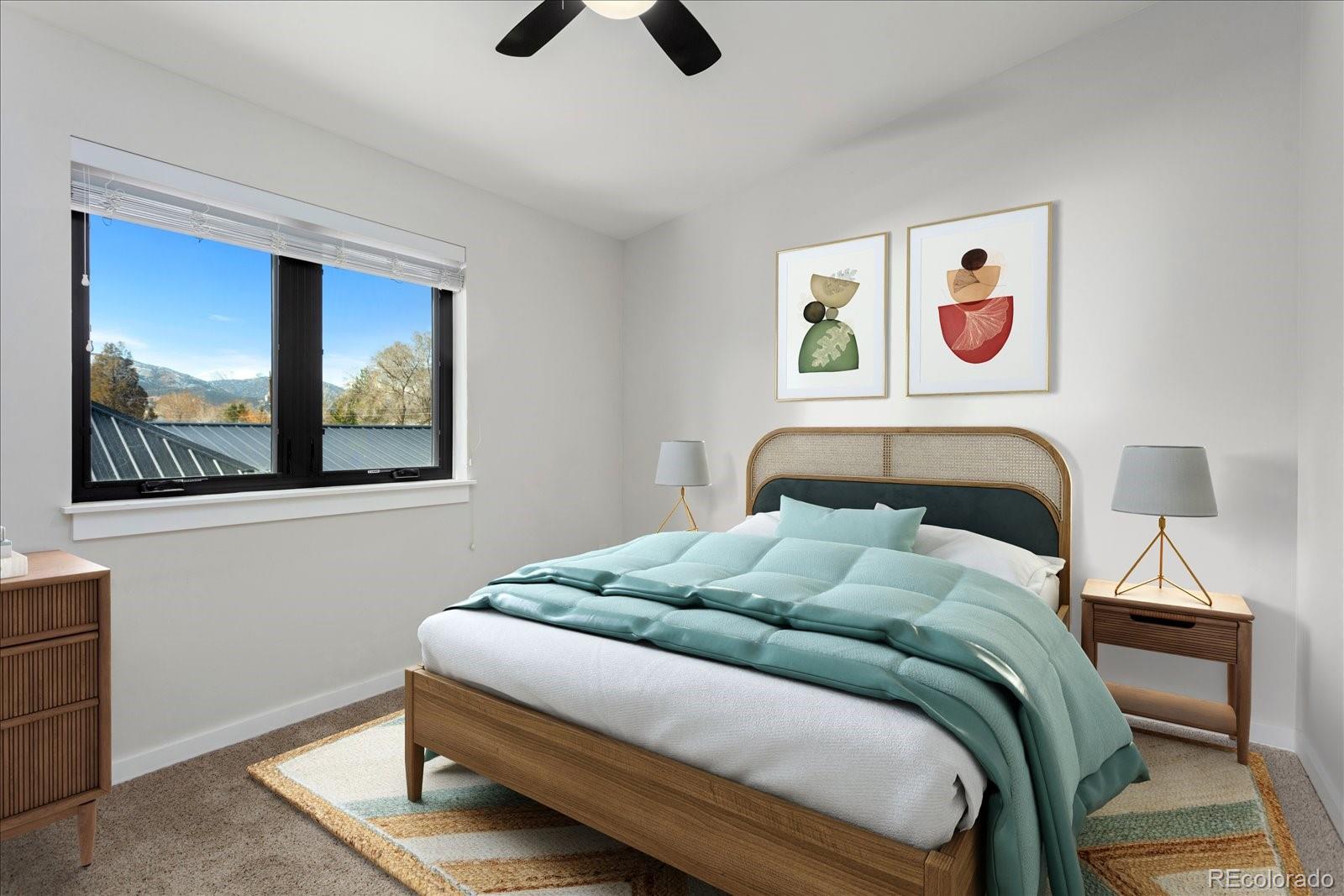 1036 H Street Salida, CO 81201 - Photo 44 of 50 a bedroom with a bed and a painting on the wall