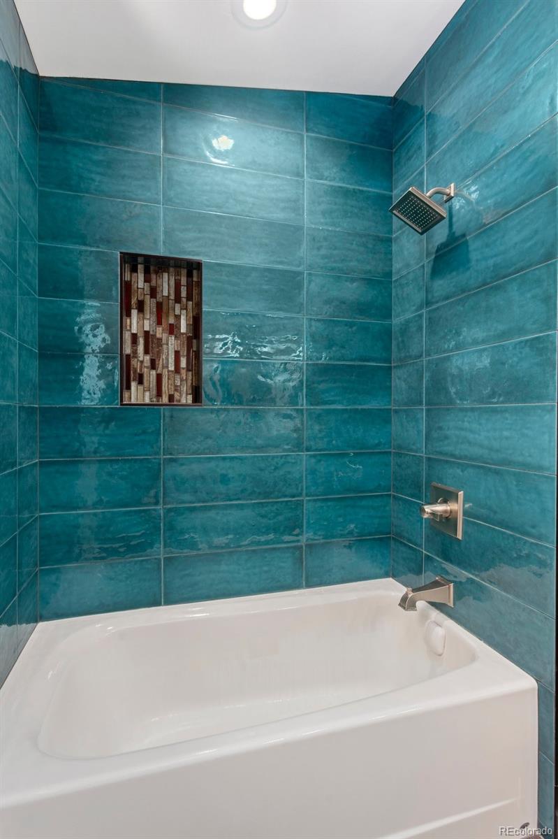 1036 H Street Salida, CO 81201 - Photo 46 of 50 a bathroom with a bathtub and shower